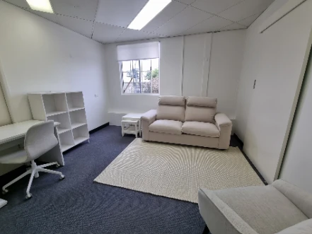 Assembled desk, bookshelf and sofa